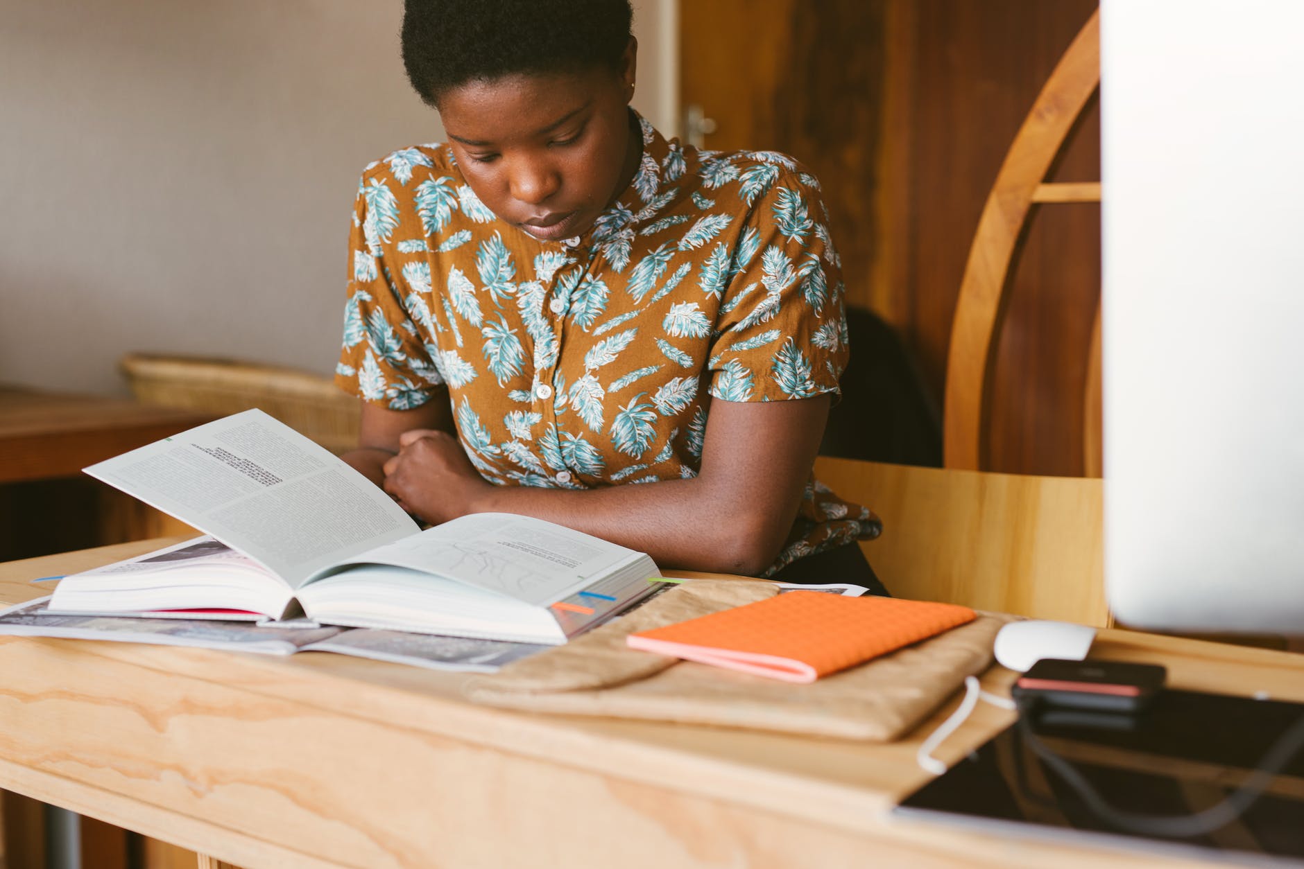 photo of woman reading books