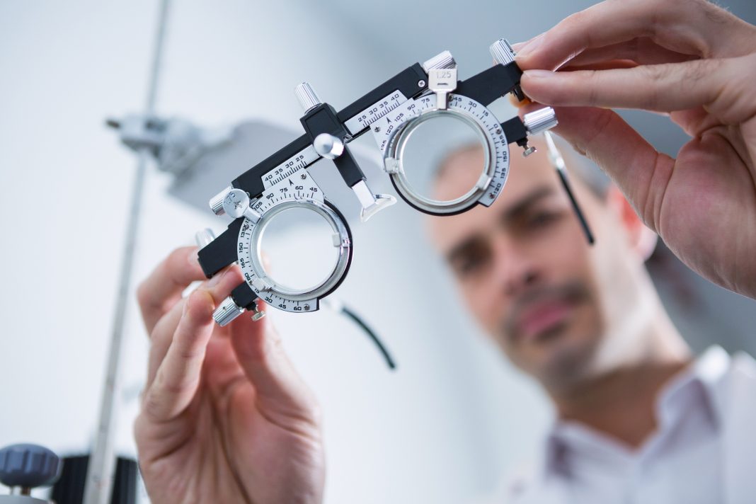 close up of optometrist holding messbrille in ophthalmology clinic