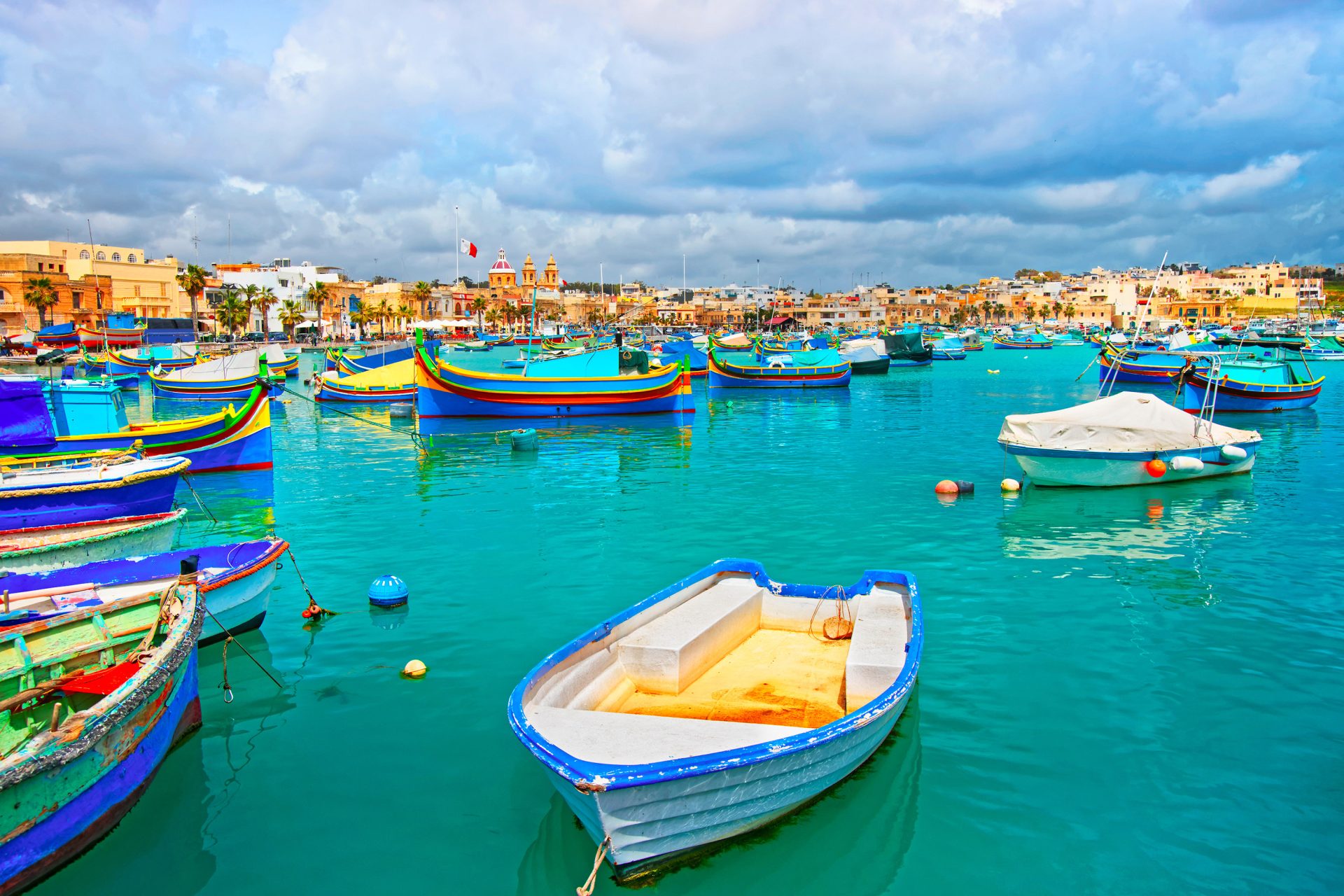 luzzu boats in marsaxlokk harbor of bay mediterranean sea malta