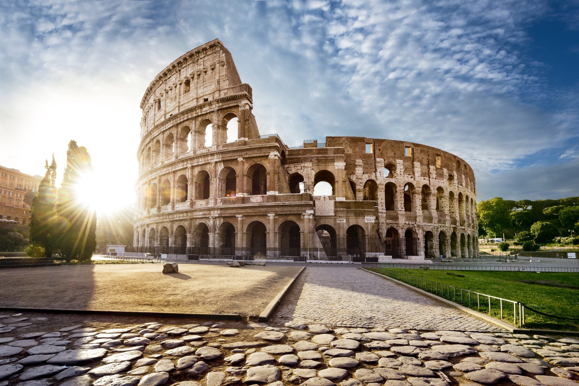 colosseum in rome and morning sun, italy