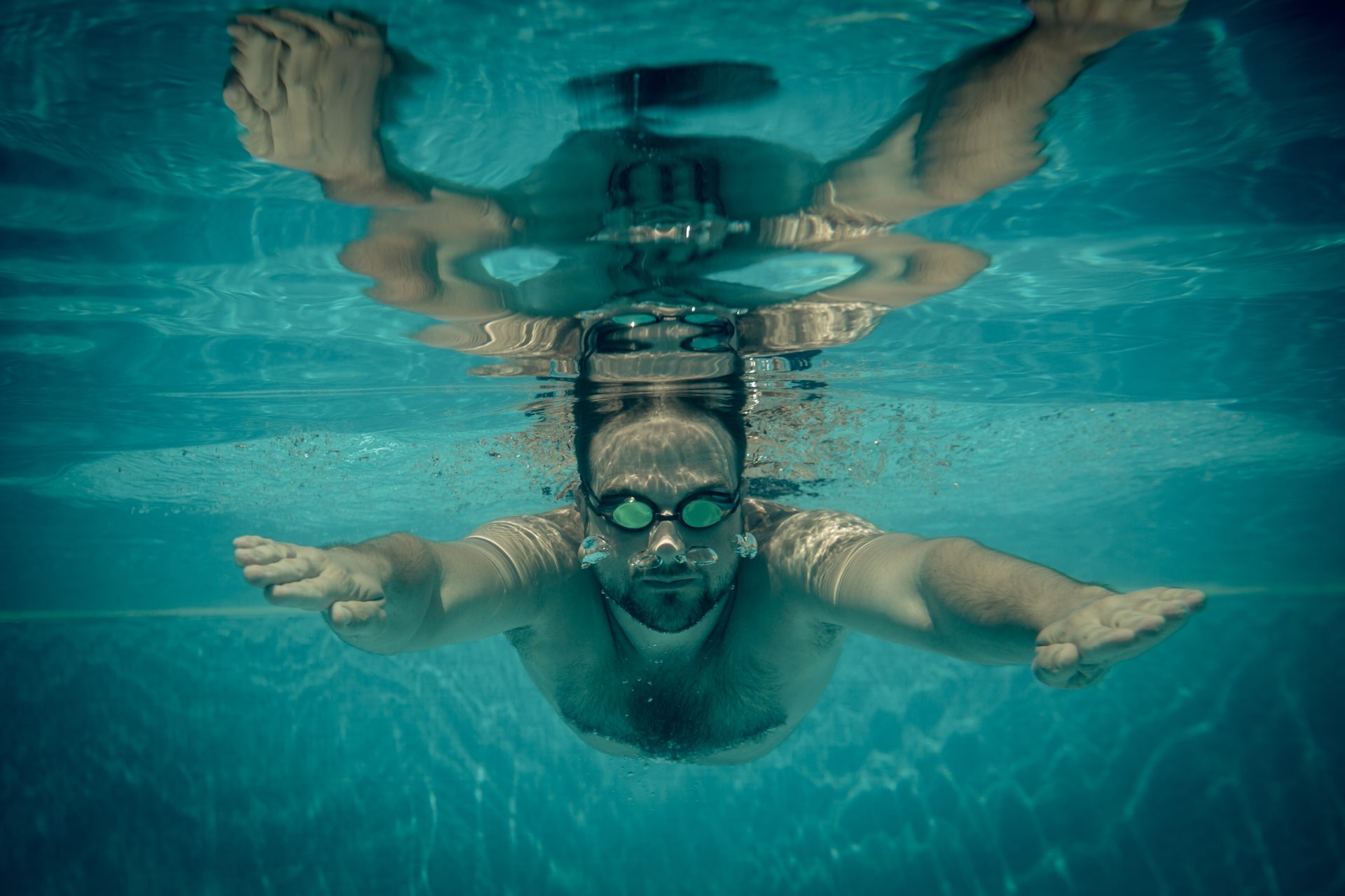 underwater portrait of young man